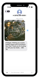 Smartphone screen showing an automated holiday text message from a tax firm, including a festive image and personalized greeting.